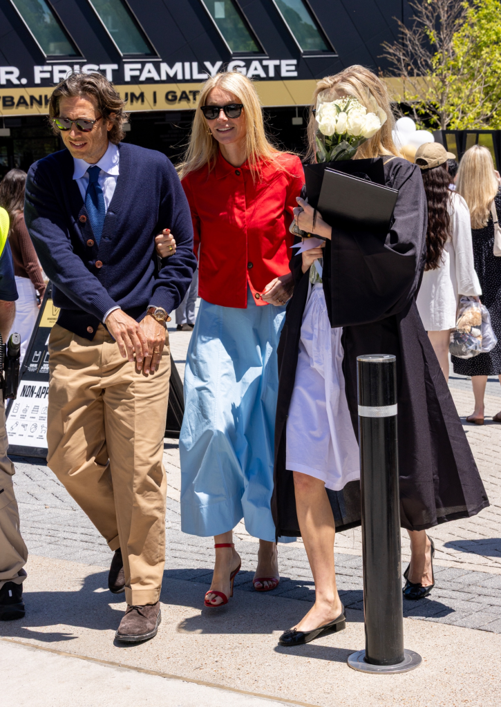Gwyneth Paltrow, Brad Falchuk, and Apple Martin walking arm-in-arm at Apple's Nashville graduation.