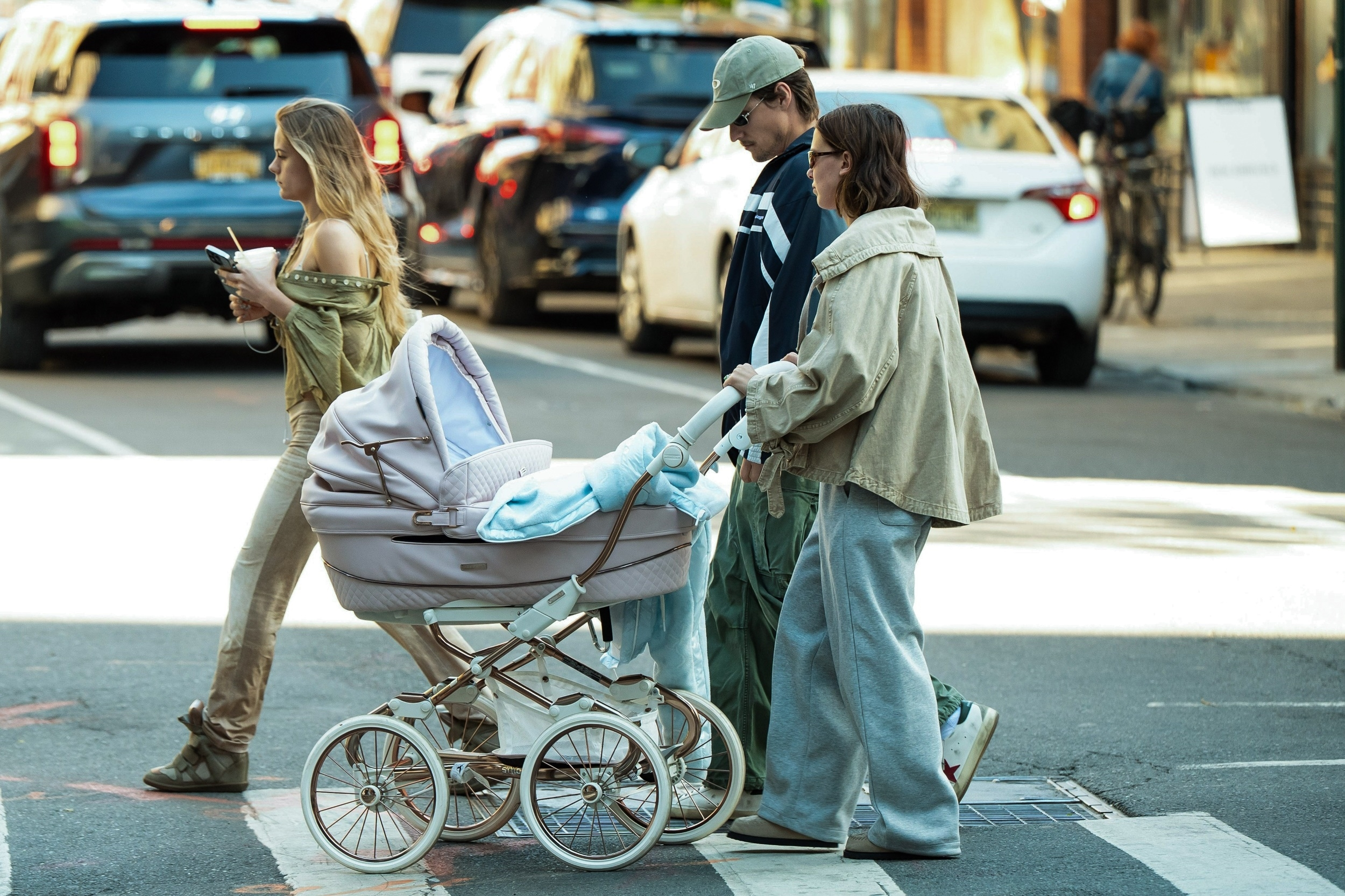 Millie Bobby Brown and Jake Bongiovi pushing a pink stroller in New York City.