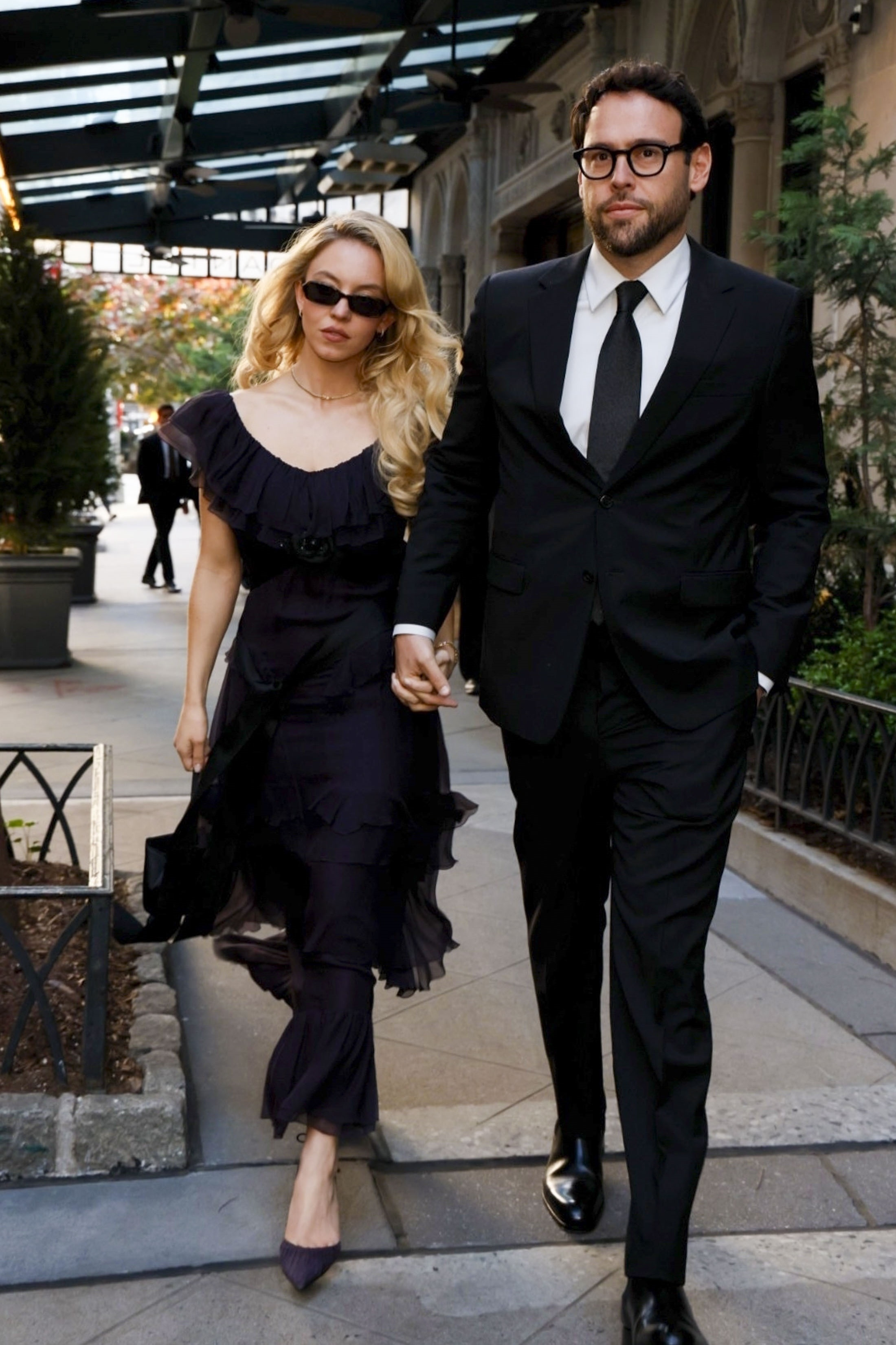 Sydney Sweeney and Scooter Braun walking hand-in-hand in New York City.