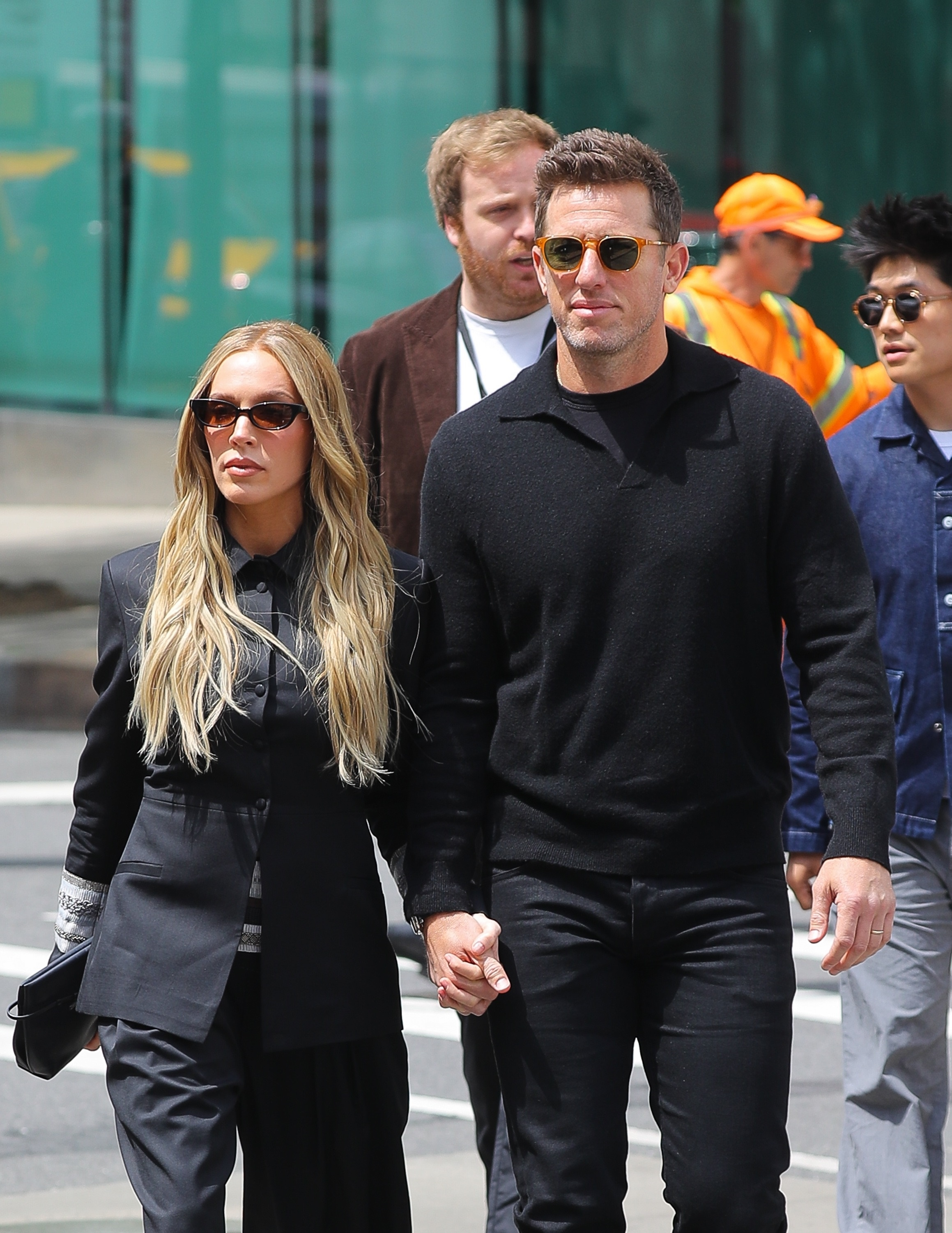 Alexandra Cooper and Matt Kaplan holding hands while walking in New York City.