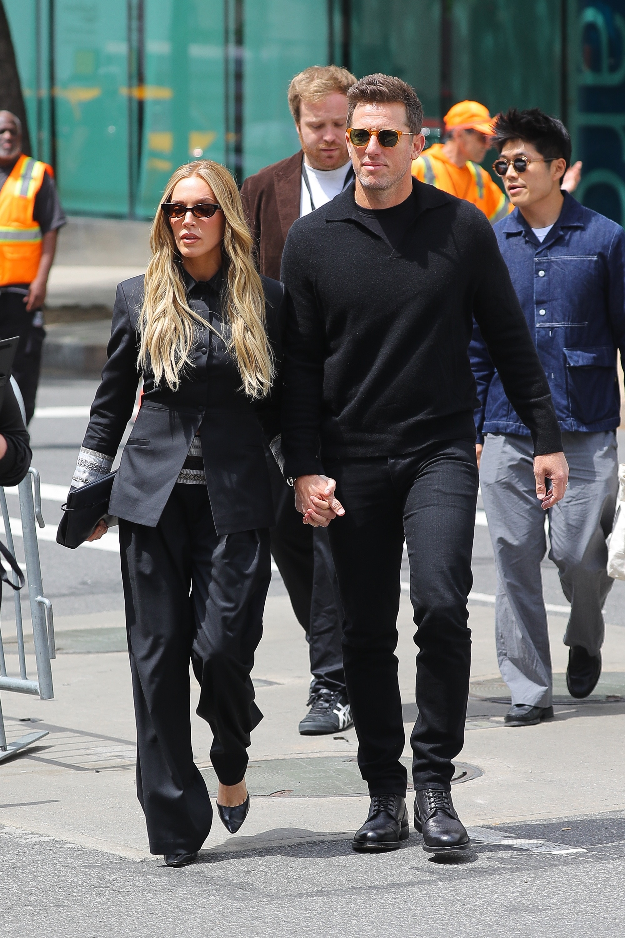 Alexandra Cooper and Matt Kaplan walking hand in hand in New York City.