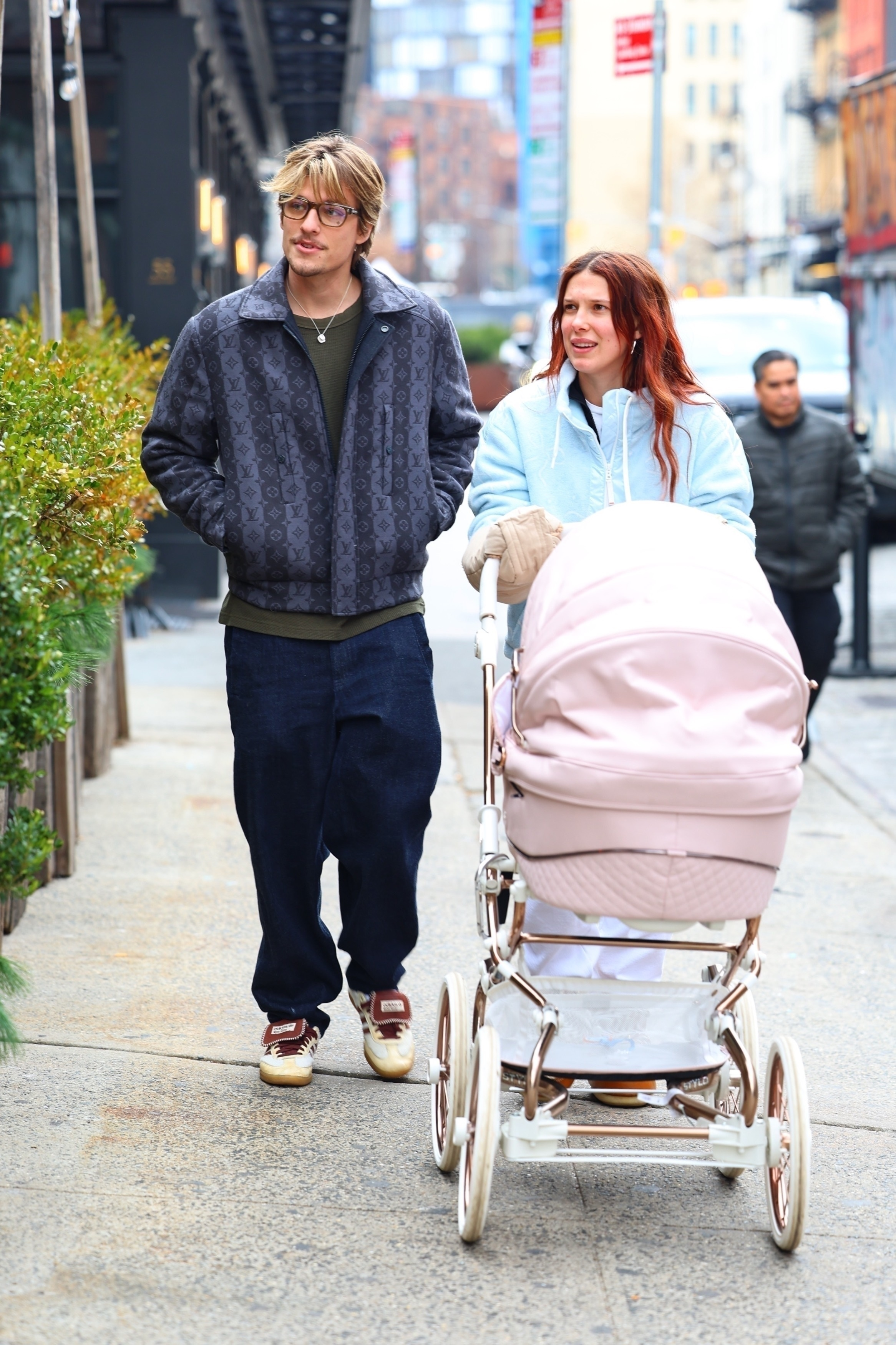 Millie Bobby Brown and Jake Bongiovi shopping in West Village, pushing a pink stroller.