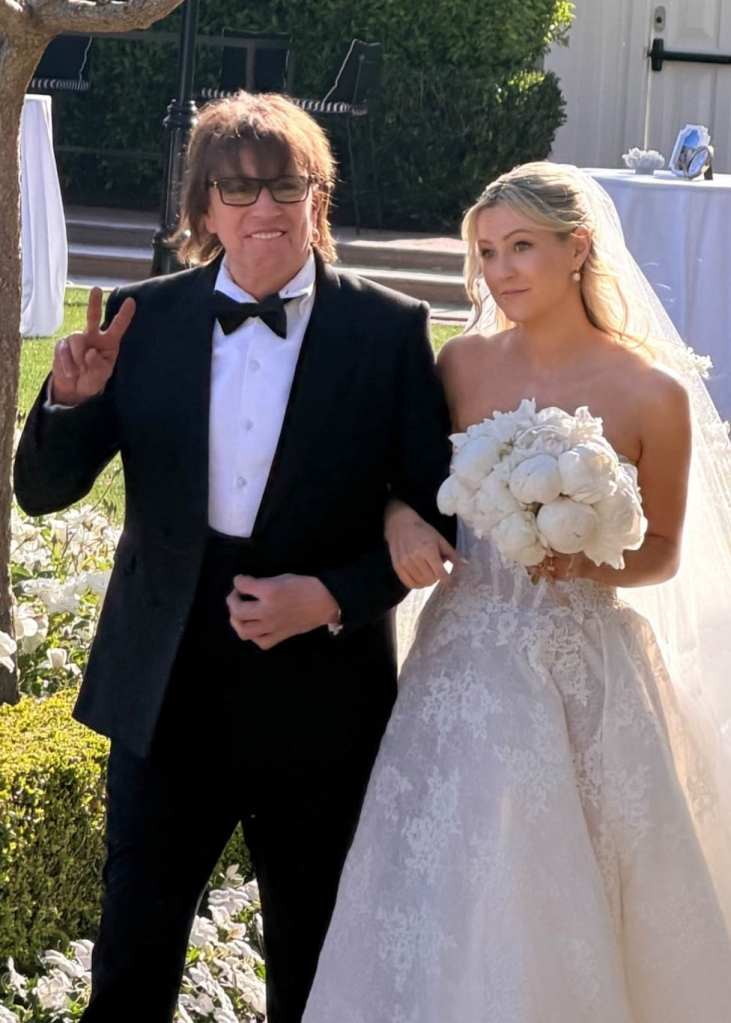 Richie Sambora walks his daughter Ava Sambora down the aisle at her wedding.