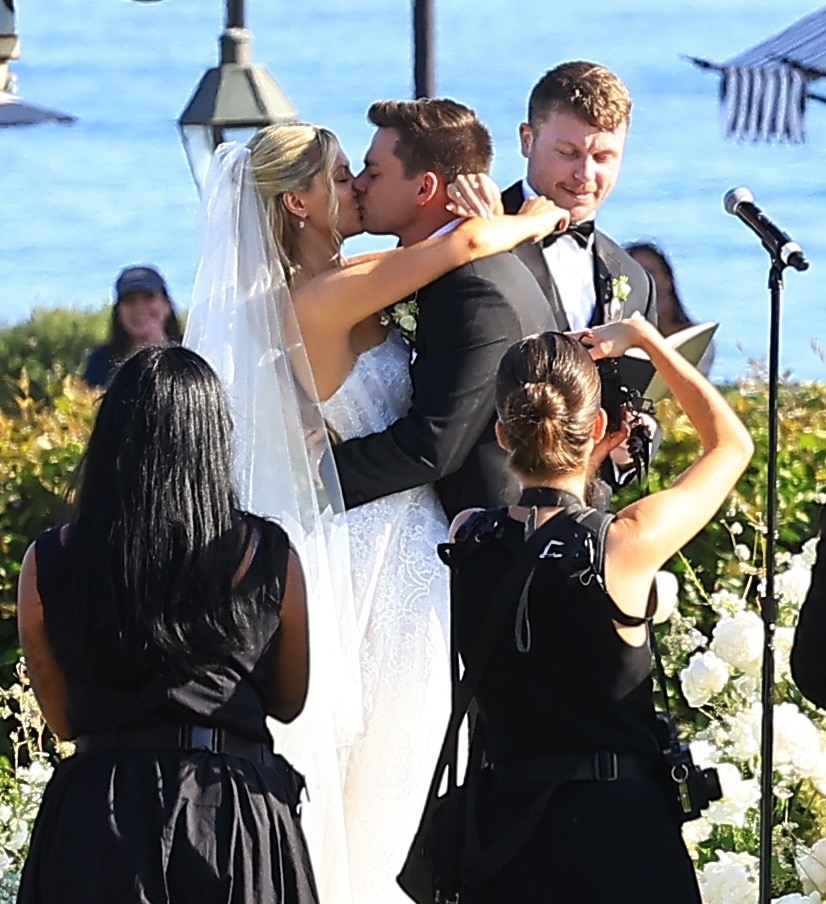 Ava Locklear and Tyler Farrar kiss at their wedding ceremony.