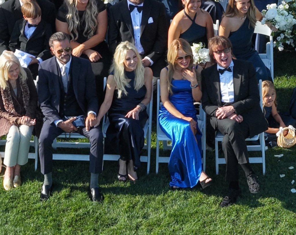 Heather Locklear, Richie Sambora, and Lorenzo Lamas at a wedding.