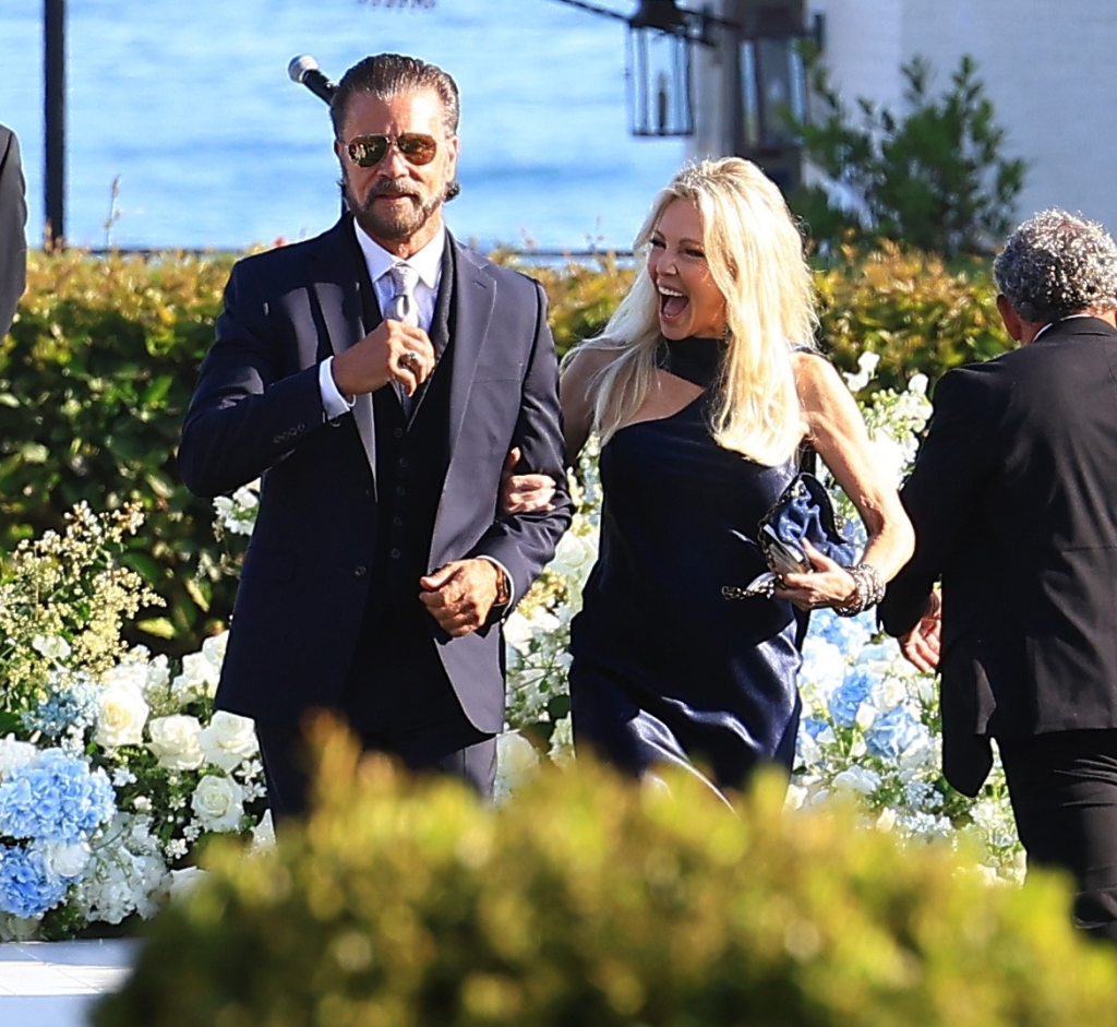 Heather Locklear and Lorenzo Lamas walk arm-in-arm at Ava Locklear's wedding.