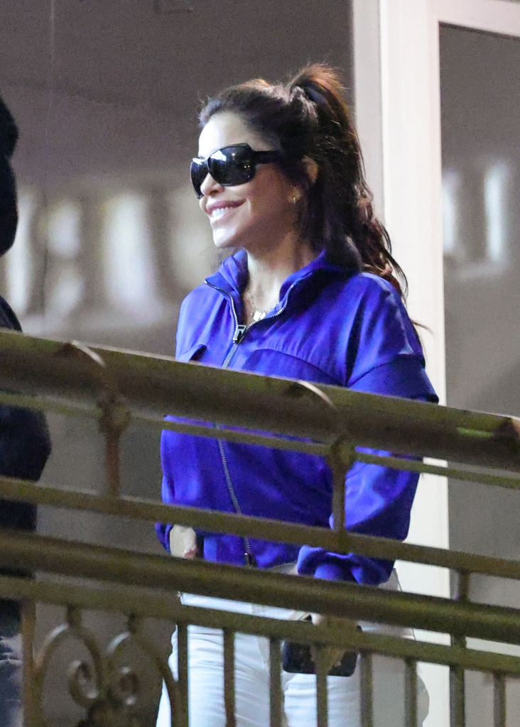 Lauren Sanchez Bezos smiling while wearing sunglasses and a blue jacket.