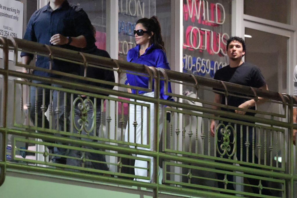 Lauren Sanchez Bezos, Nikko Gonzalez, and Tony Gonzalez walking along a railing at night in West Hollywood.