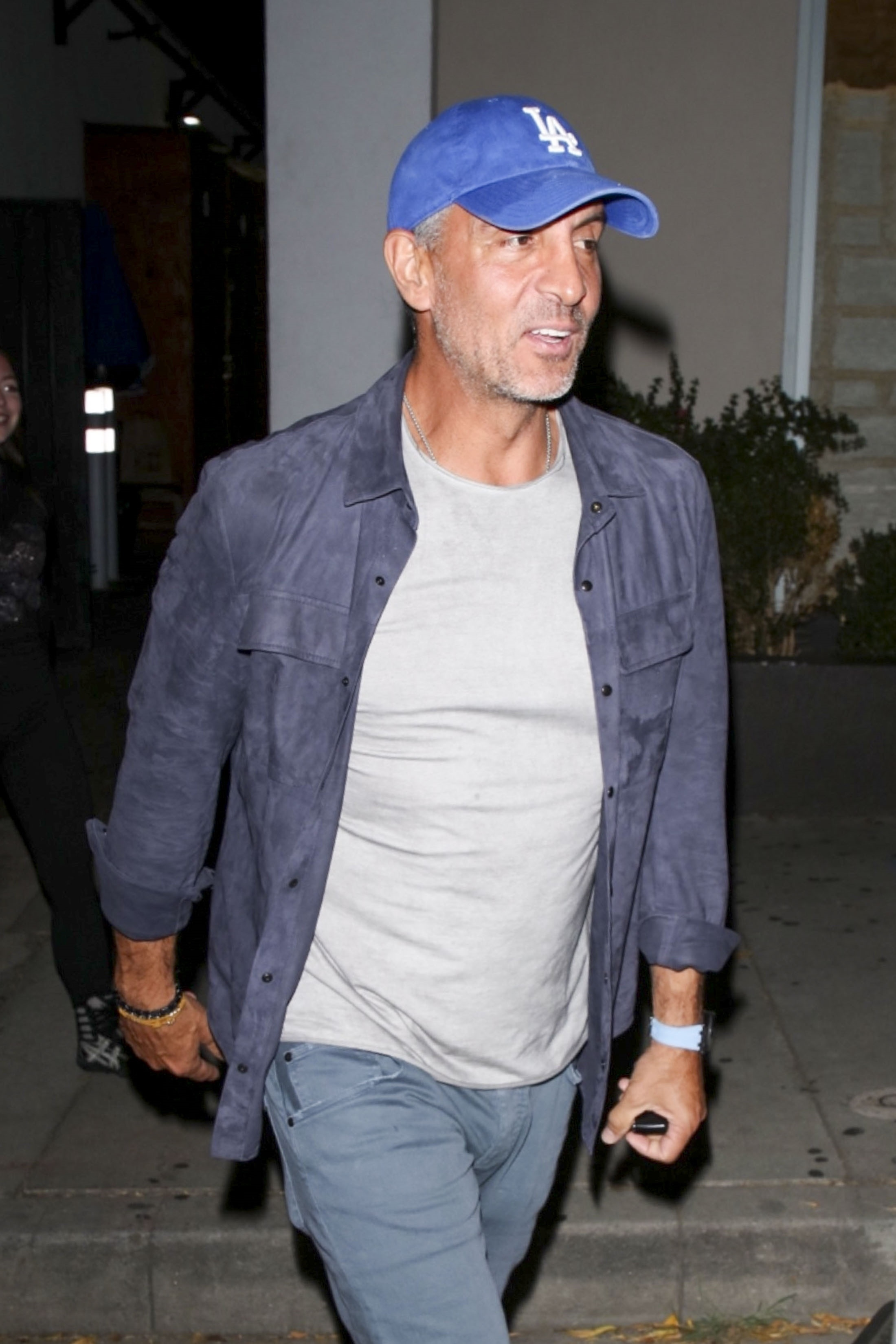 Mauricio Umansky leaving Craig's in West Hollywood, wearing a blue Los Angeles Dodgers cap.