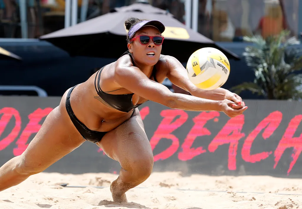 Falyn Fonoimoana diving for the ball during an AVP Austin Open beach volleyball match.