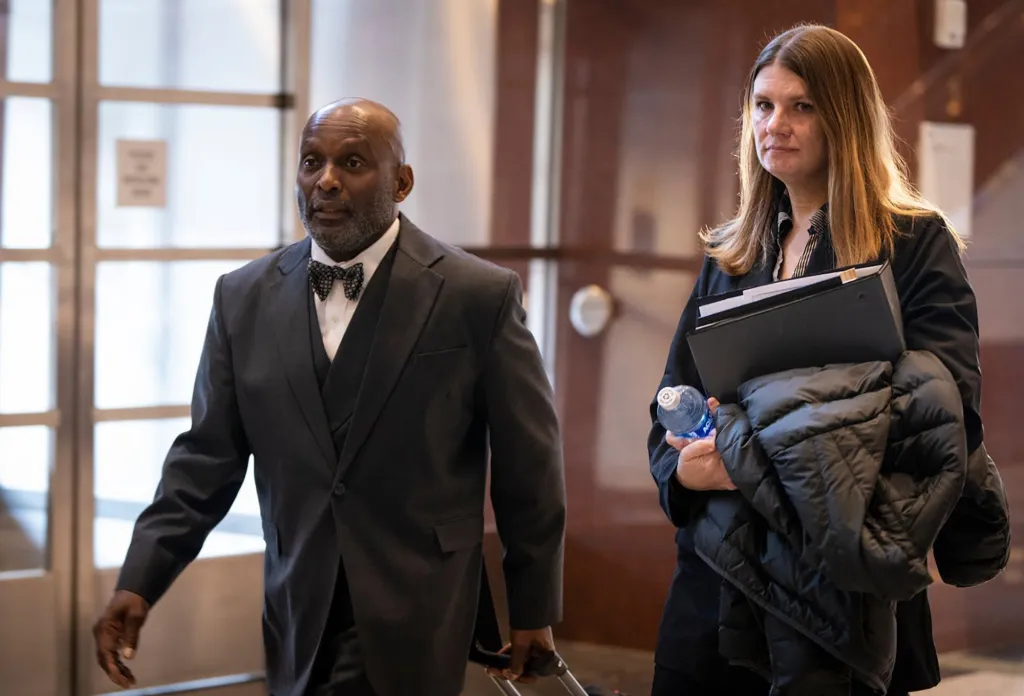 Aimee Bock and her attorney, Kenneth Udoibok, walking into federal court.