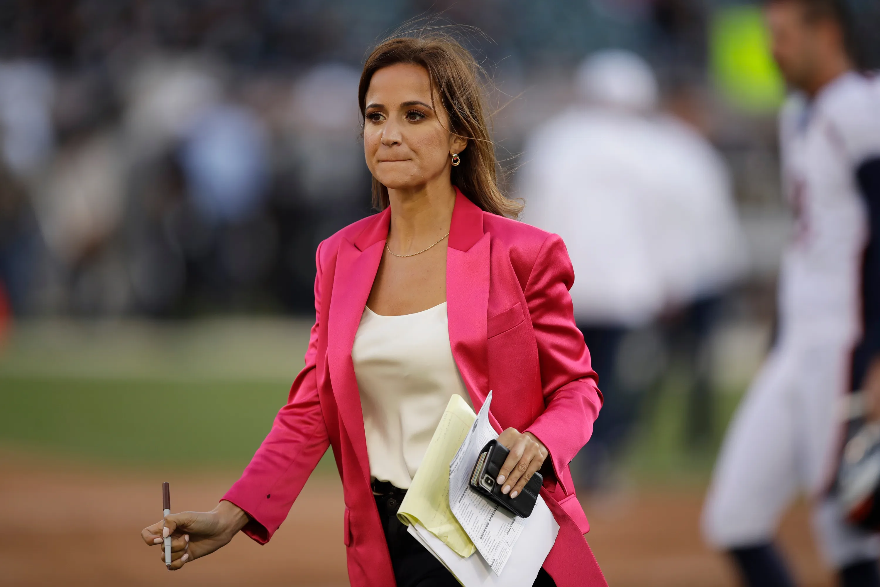 Dianna Russini at work on the sidelines of a football game
