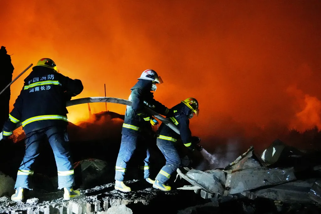 Firefighters work to distinguish a fire following a blast at a fireworks manufacturing factory in Liuyang, Hunan province, China, May 5, 2026.