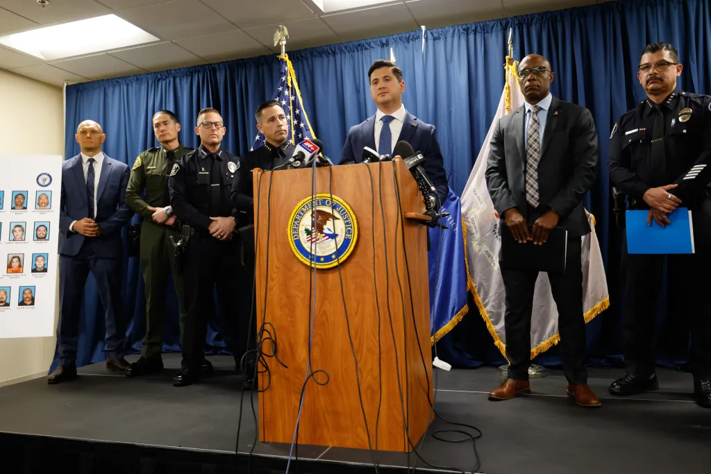 First Assistant United States Attorney Bill Essayli speaks at a press conference with federal agents after apprehending 37 members and associates of the Mexican Mafia.