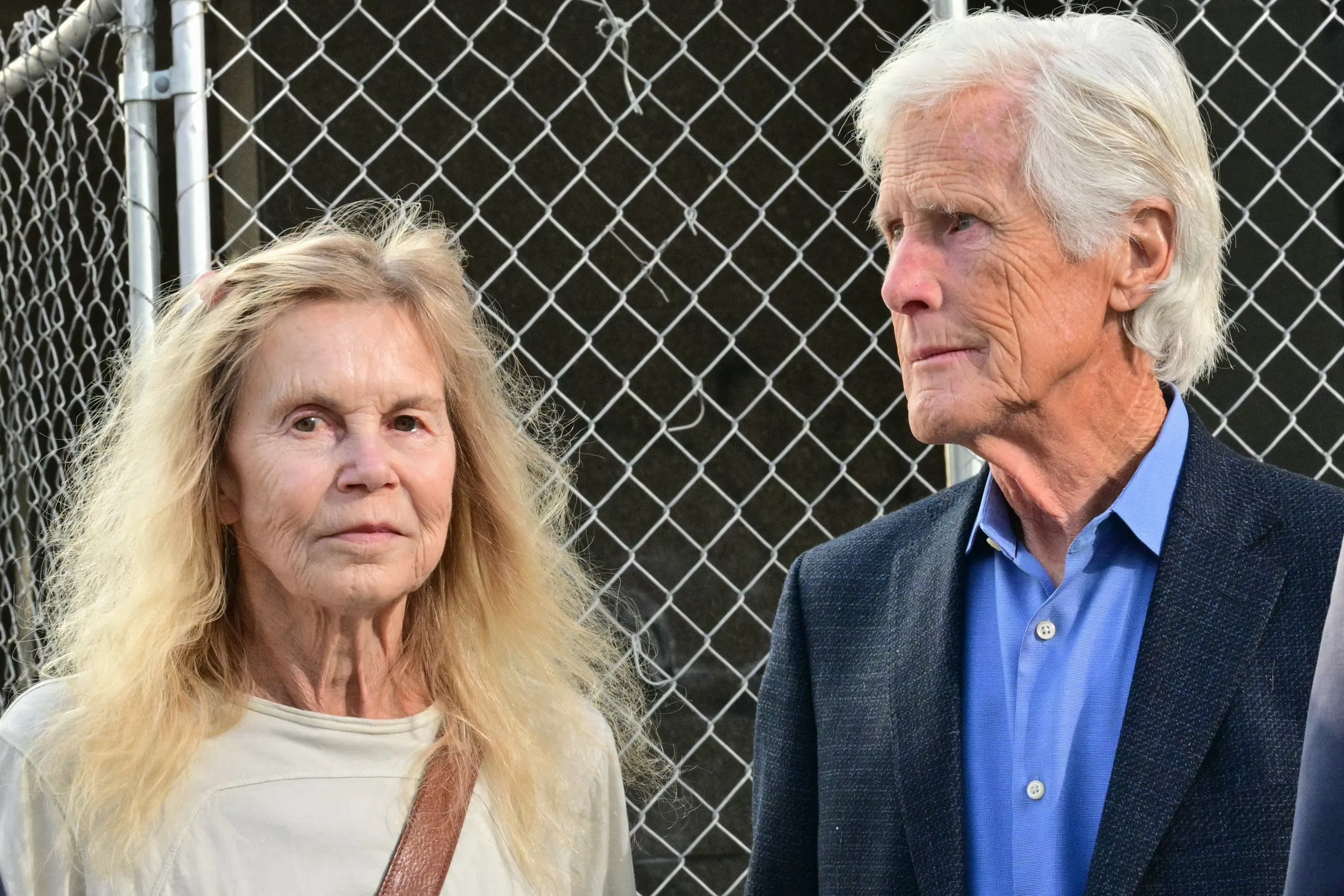 Suzanne Perry and Keith Morrison at a courthouse.
