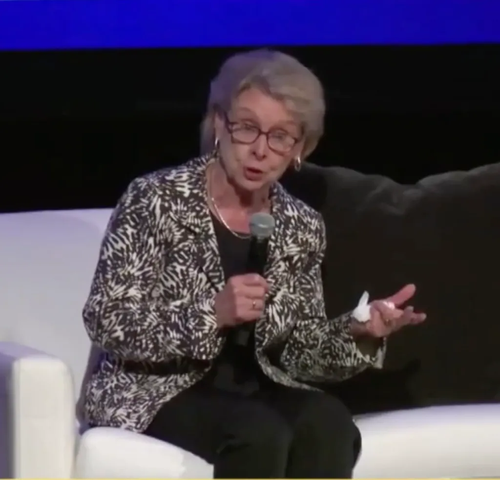 Former Democratic Washington Gov. Christine Gregoire speaking into a microphone.
