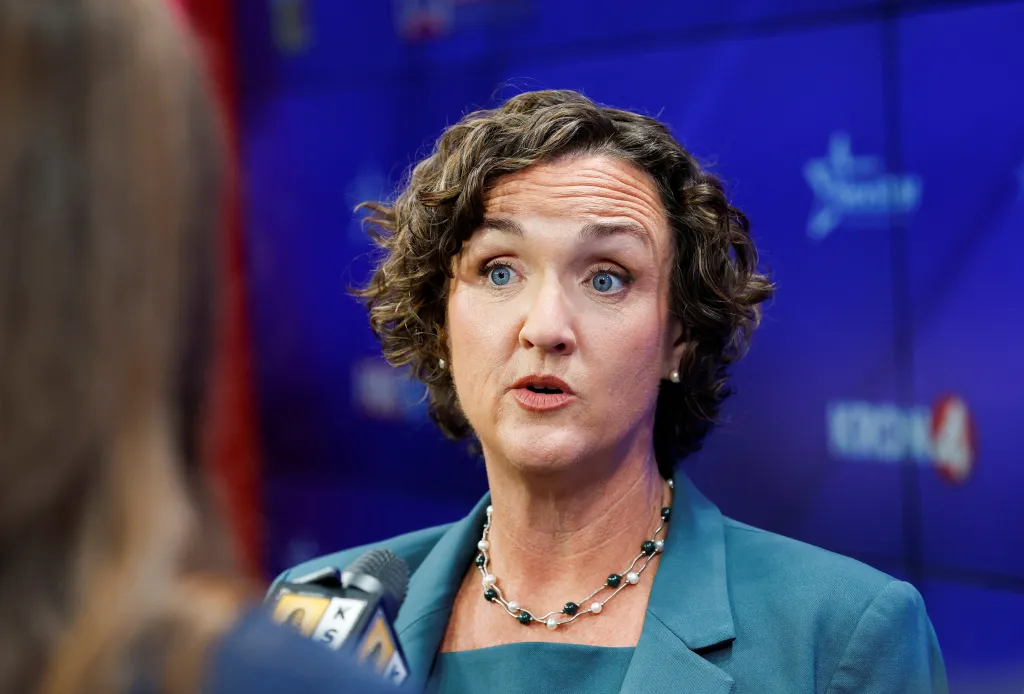 Former U.S. Representative Katie Porter speaks to the press.