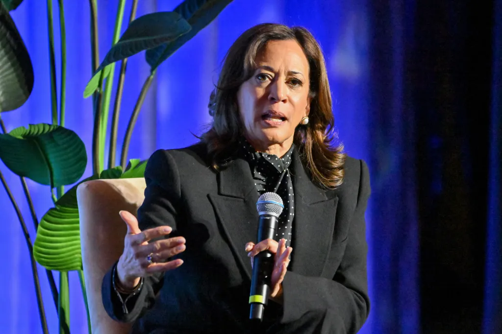Kamala Harris speaking into a microphone.