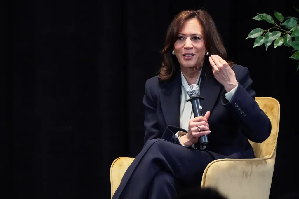 Kamala Harris speaking into a microphone.
