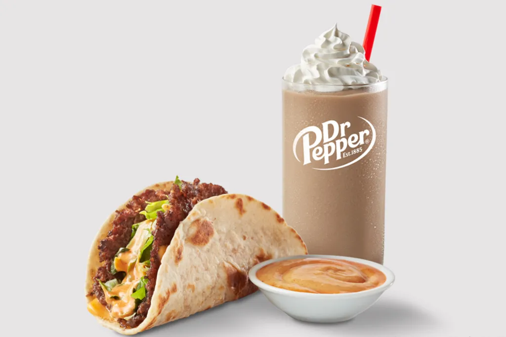 Freddy's Mother's Day Special with a taco, a side of sauce, and a Dr. Pepper shake.