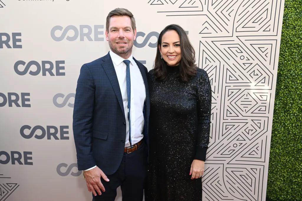 Eric Swalwell and Brittany Watts posing together at the CORE Gala 2022.