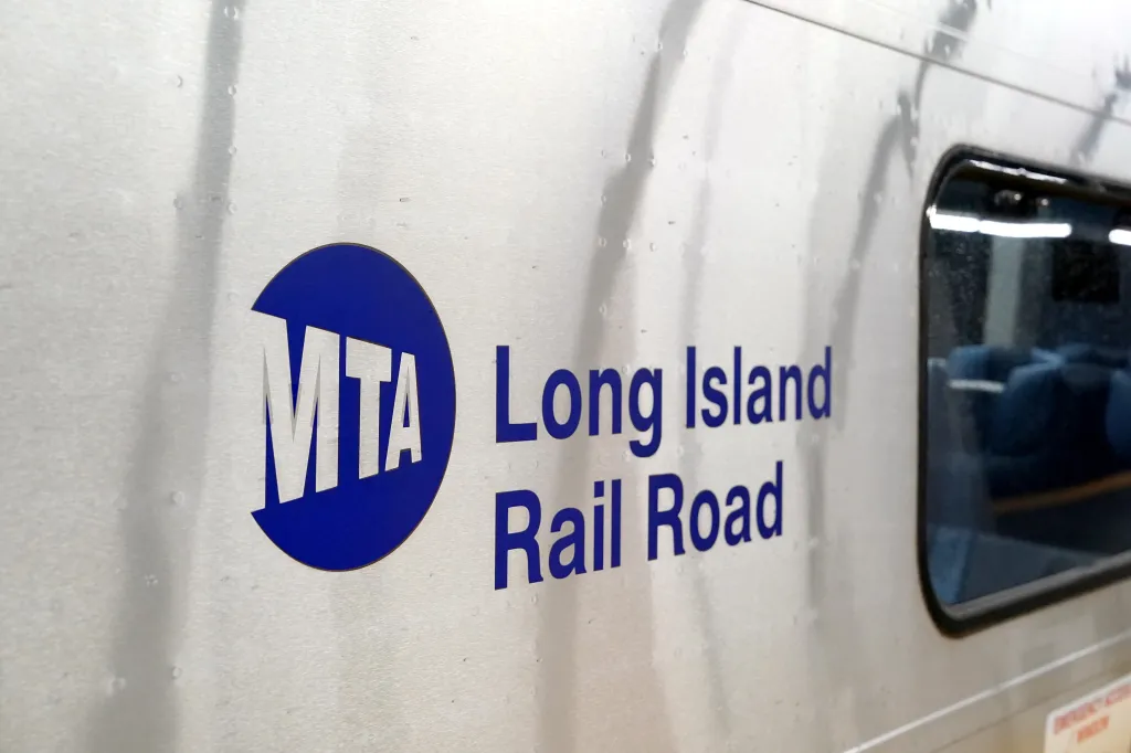 Side of a Long Island Railroad train with an MTA logo and 