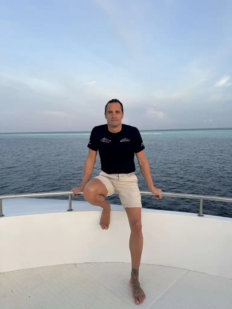 Federico Gualtieri on a boat with the ocean in the background.