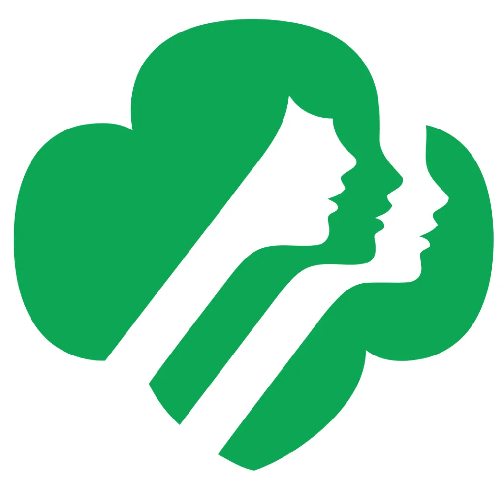 Illustration of the Girl Scouts of the USA logo, featuring two white female profiles on a green clover-like shape.