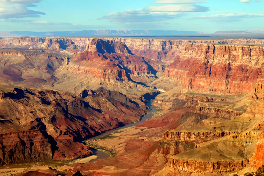 Grand Canyon National Park with a river snaking through its many rock layers.