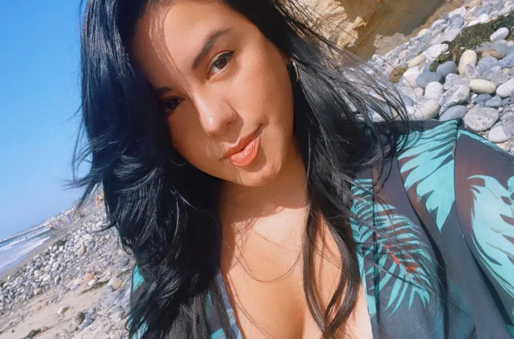 Grecia Figueroa in a close-up photo outdoors, wearing a tropical print top.