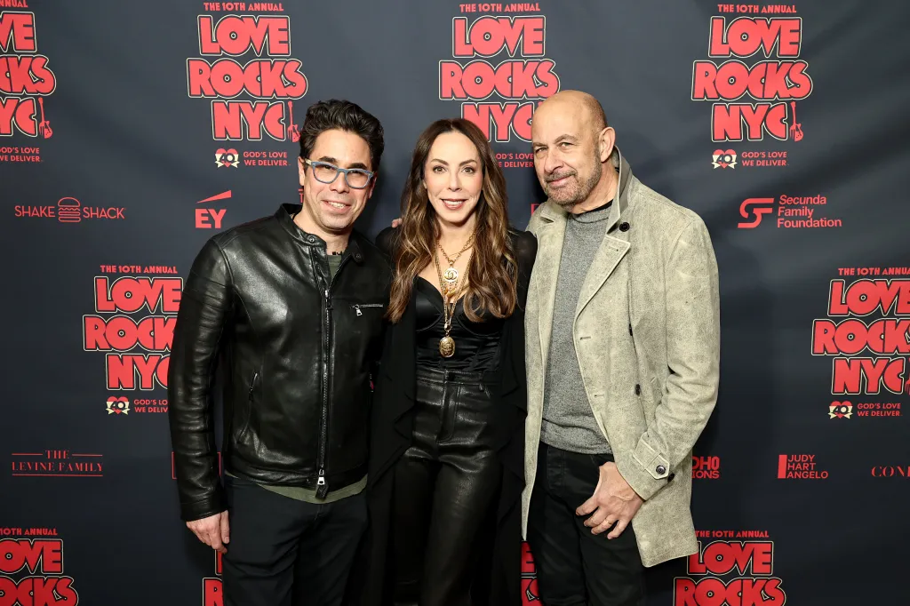 Williamson at left with Love Rocks executive producers Nicole Rechter and John Varvatos.