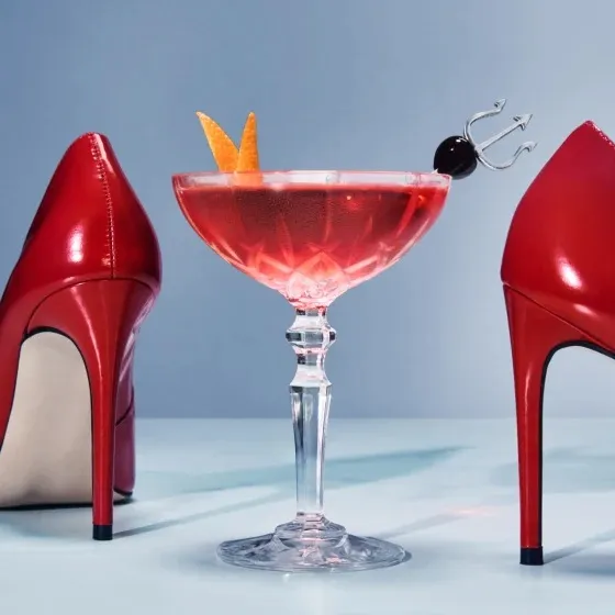 Grey Goose's Scarlet Step cocktail with red high heels.