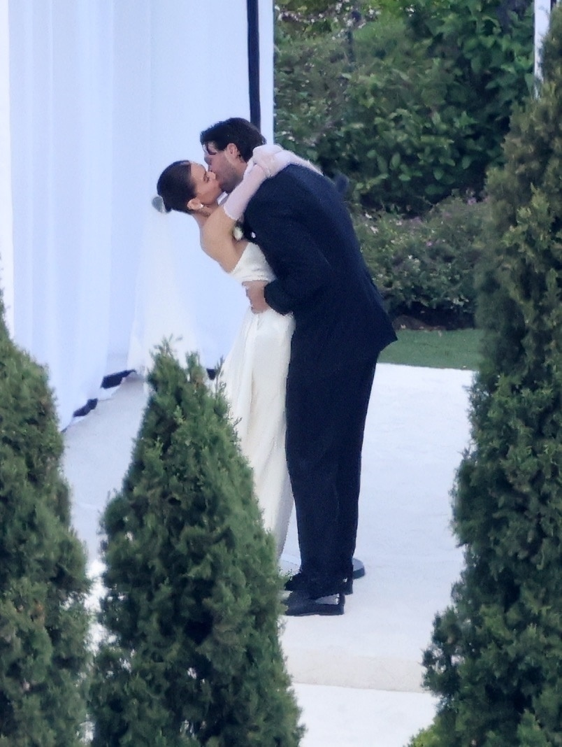 Hailee Steinfeld and Josh Allen kissing at their wedding.