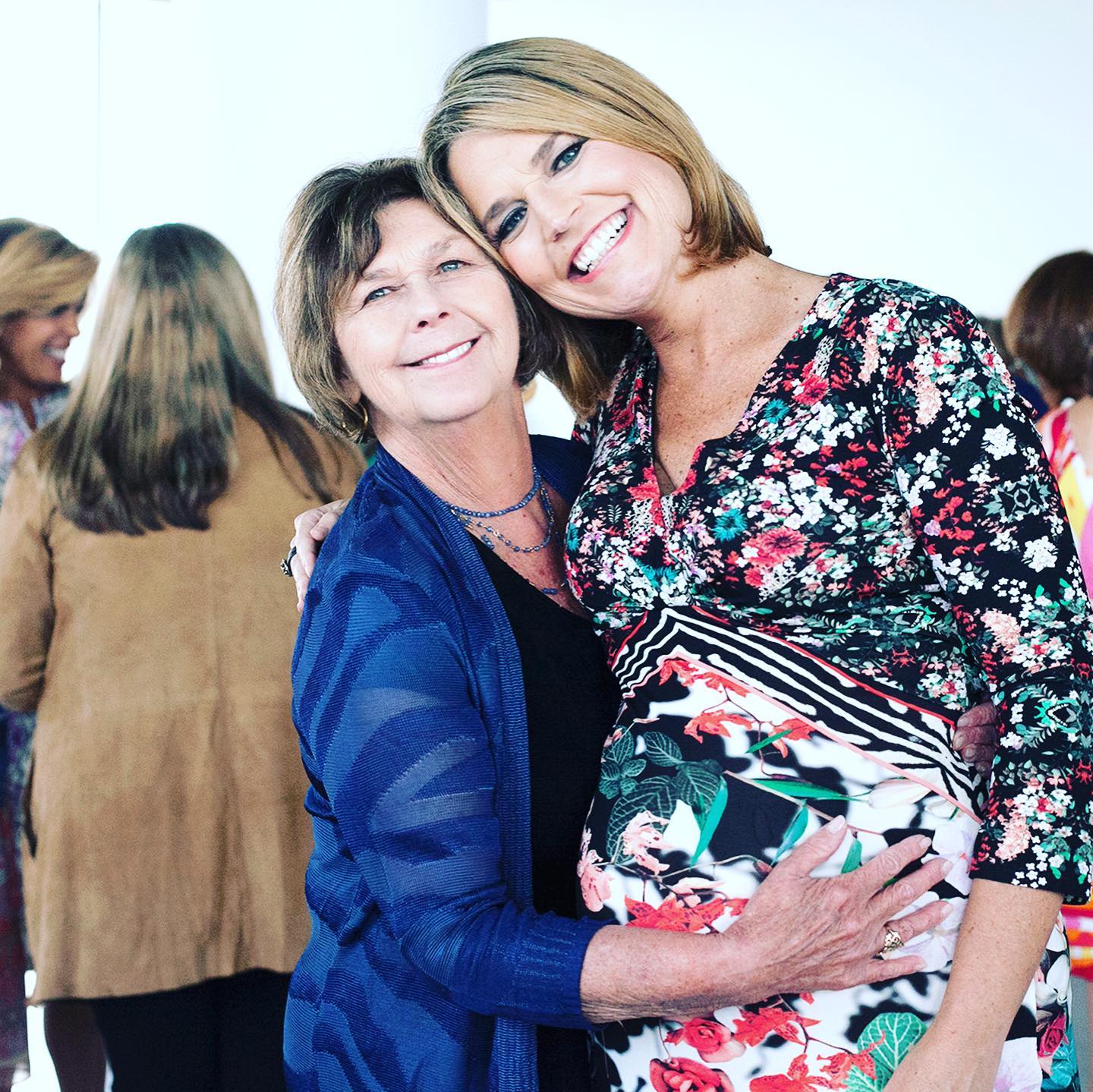 Savannah Guthrie, smiling and pregnant, embraced by her mother, Nancy Guthrie.