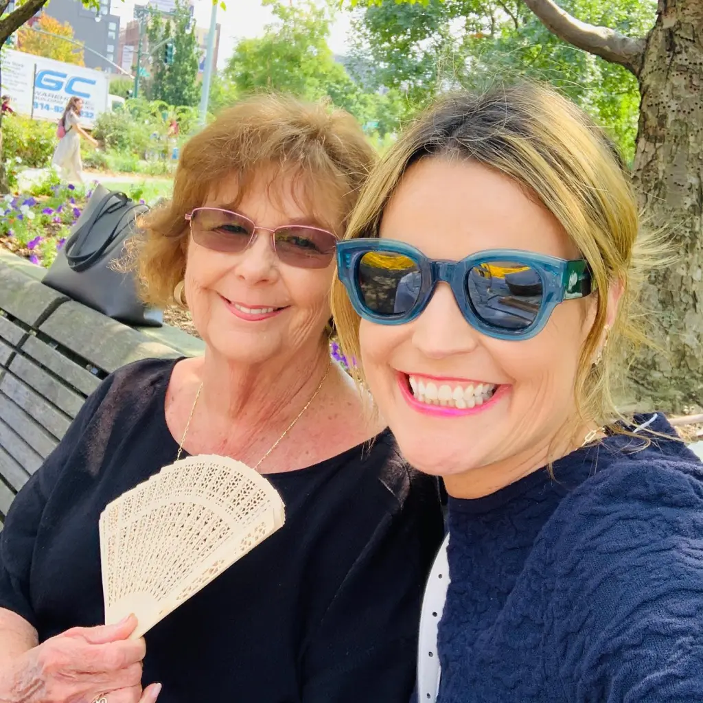 Savannah Guthrie and her mother Nancy smiling in a selfie outdoors.