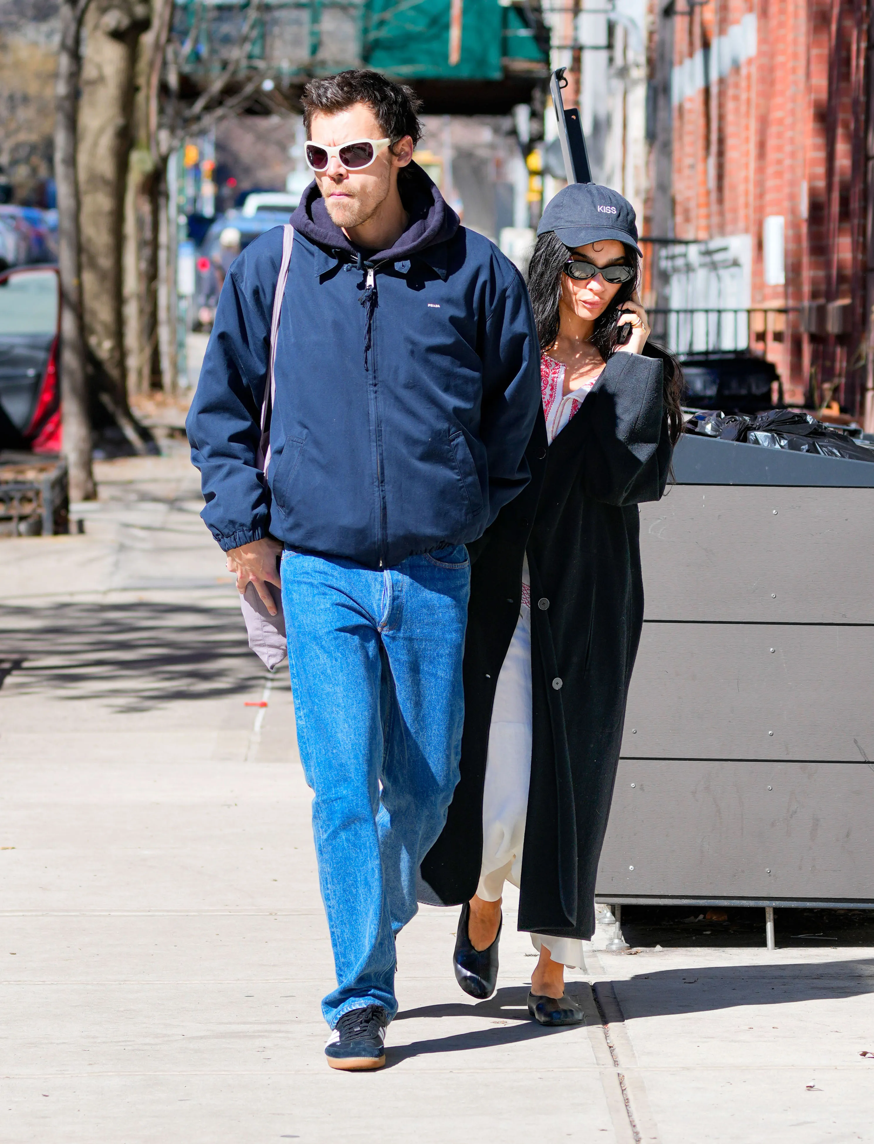 Harry Styles and Zoe Kravitz walk down the street in New York City.