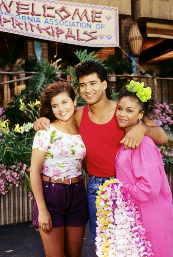 Tiffani-Amber Thiessen, Mario Lopez, and Lark Voorhies posing for 