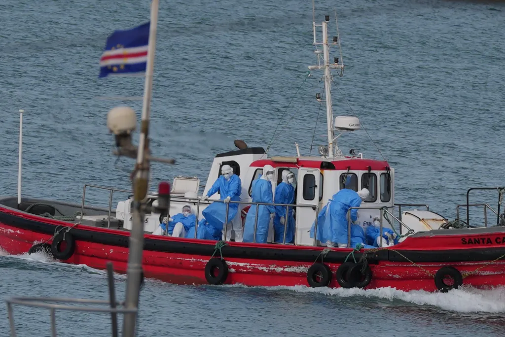 Health workers in protective gear on a boat in Cape Verde.