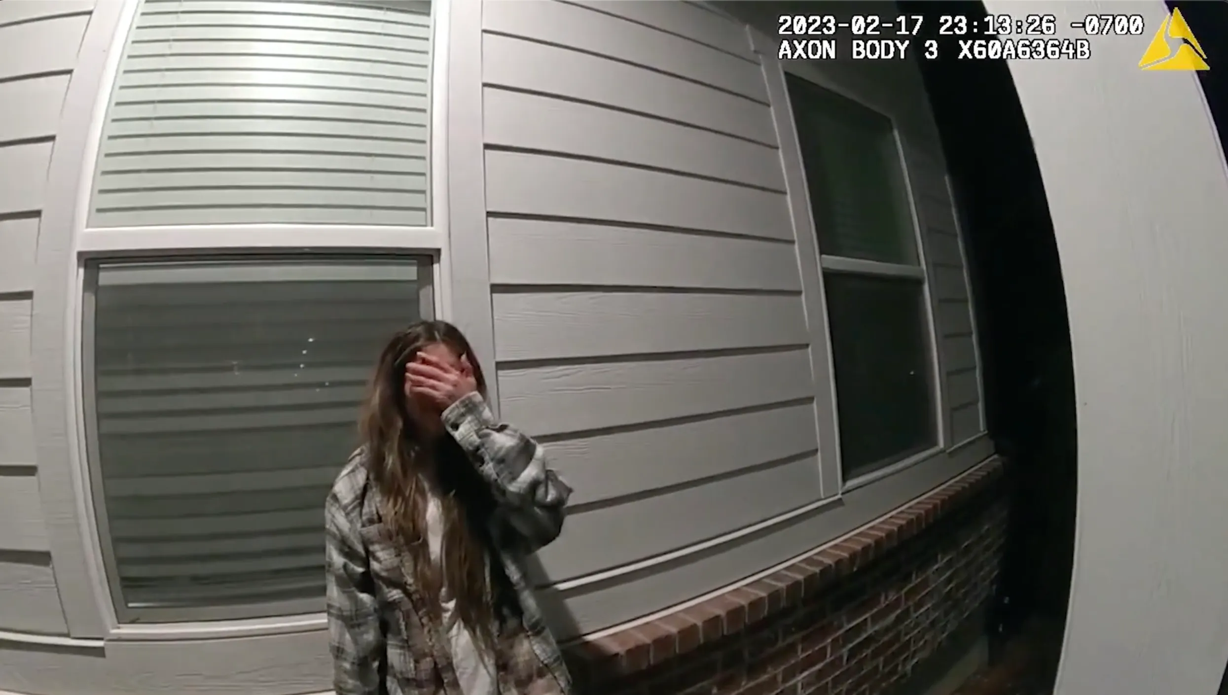 Bodycam footage of Taylor Frankie Paul covering her face during an arrest.