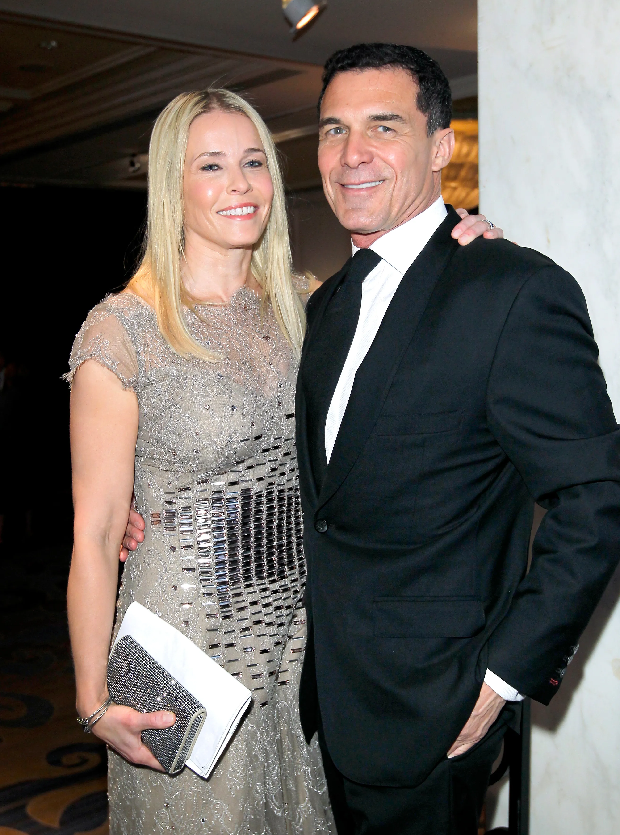 Chelsea Handler wearing a Carolina Herrera gown and Andre Balazs attend an event.