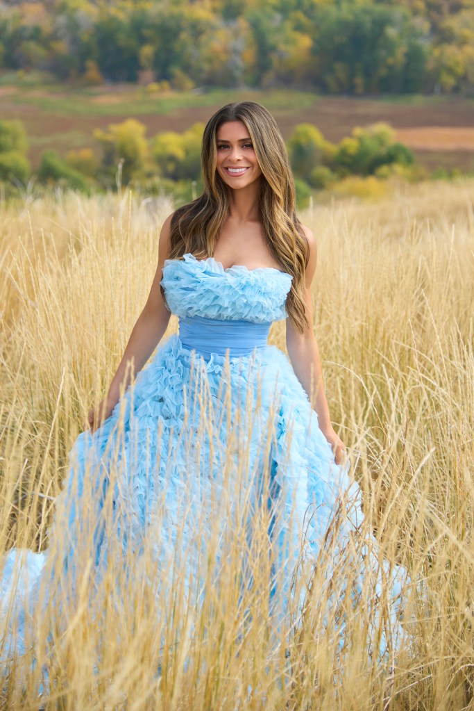 Taylor Frankie Paul in a blue dress in a field.