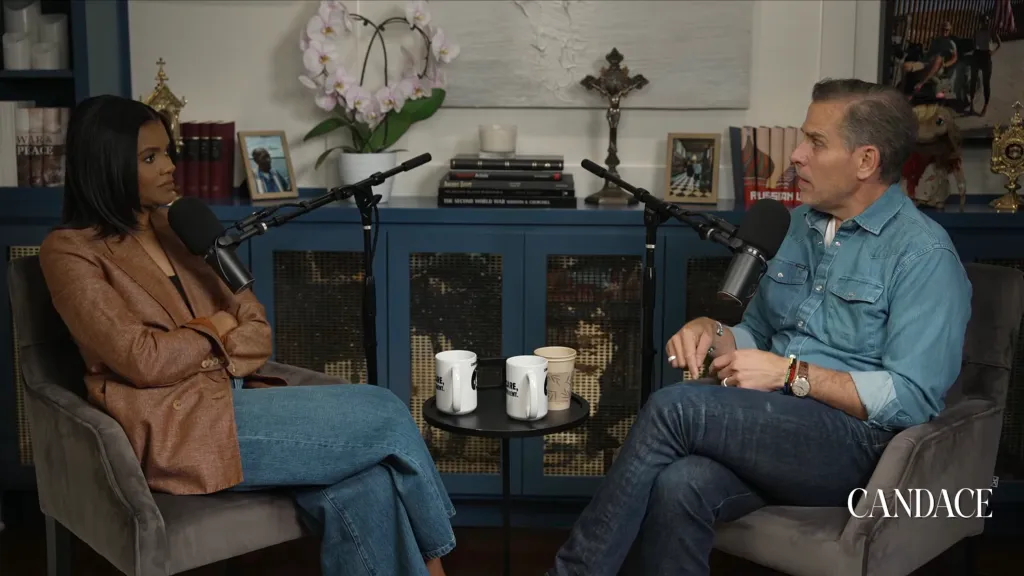 Candace Owens interviewing Hunter Biden with microphones between them and mugs on a small table.
