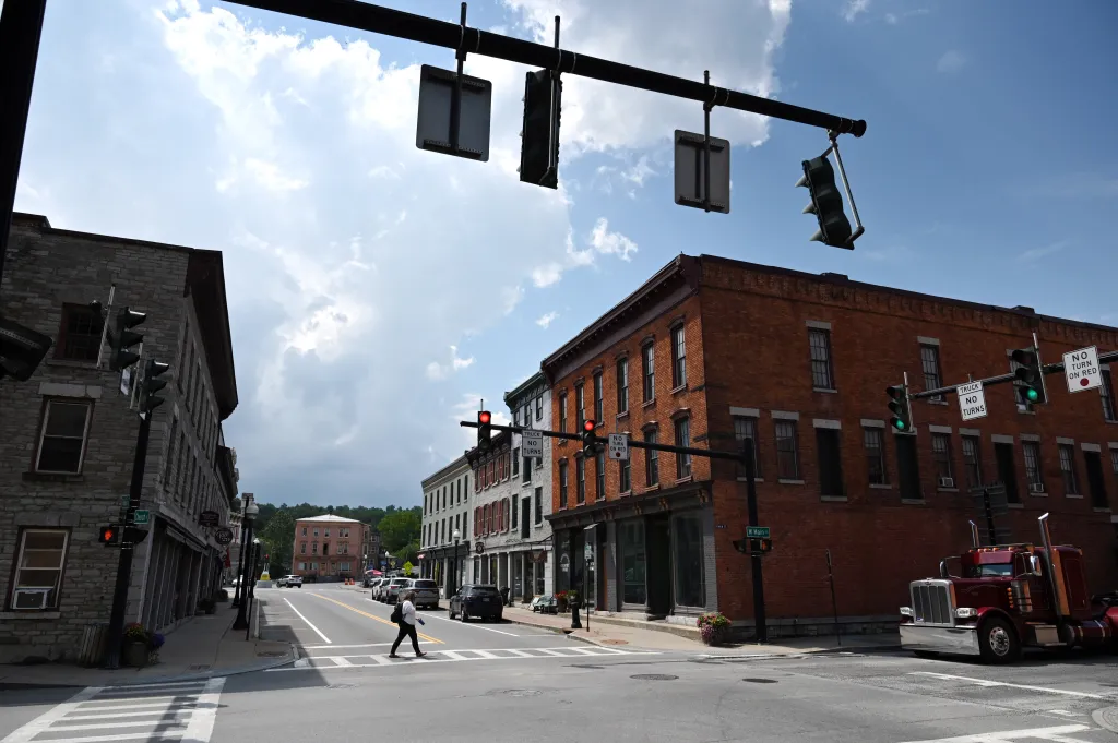 A person crosses the intersection of Church and East Main Streets in Canajoharie, New York.