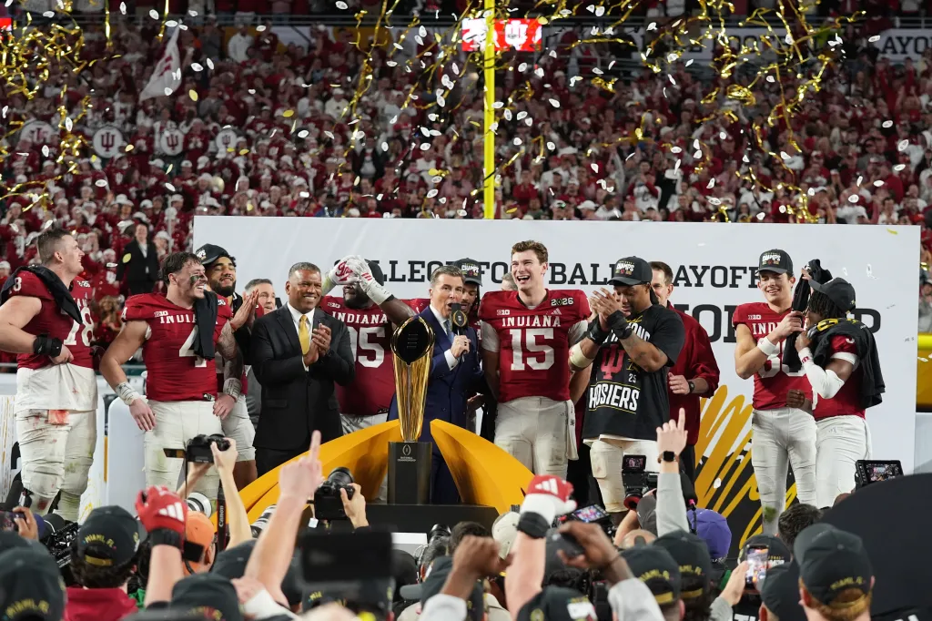 Indiana quarterback Fernando Mendoza (15) celebrating with his teammates after defeating Miami in a College Football Playoff national championship game.