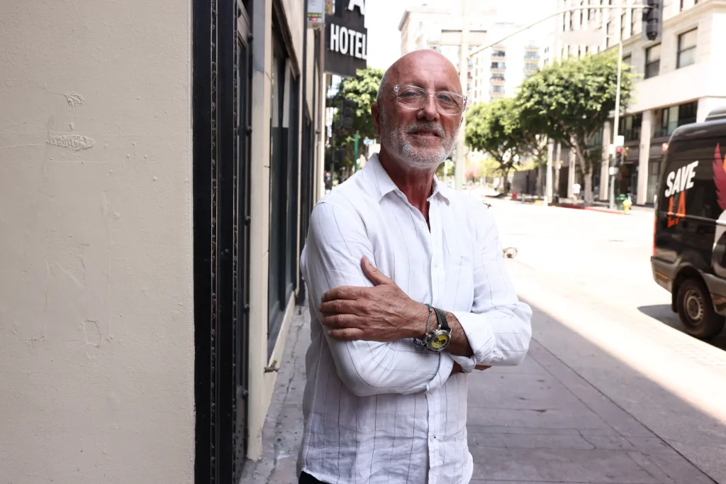 Izek Shomof, owner of the Alexandria Hotel, poses for a photo.