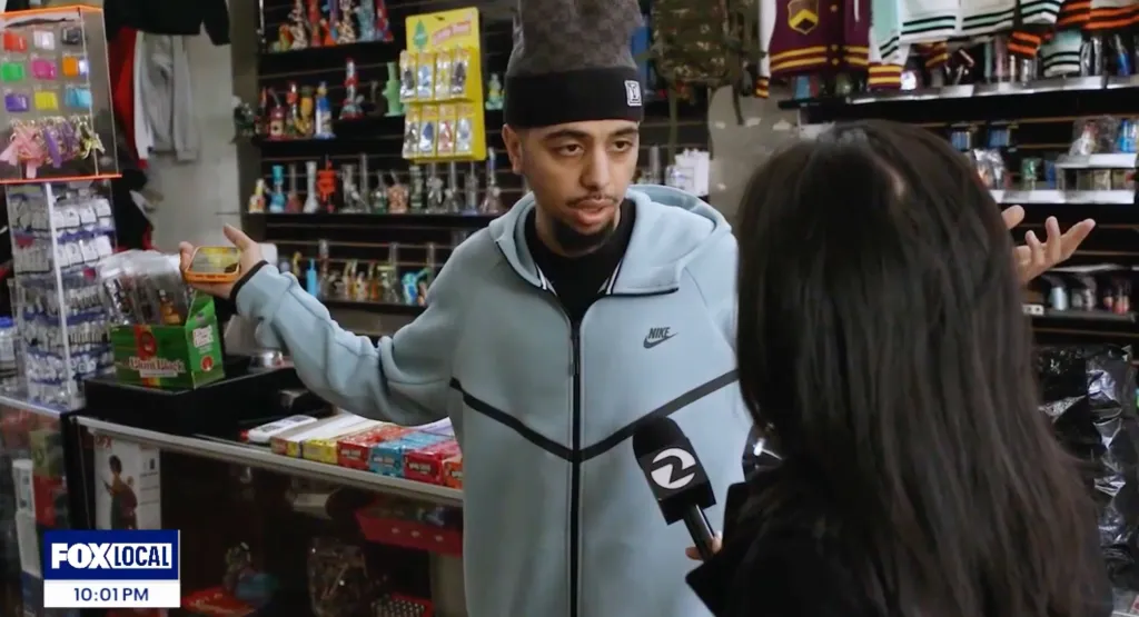 J Money, one of the Corner Store owners, being interviewed by a reporter from Fox Local.