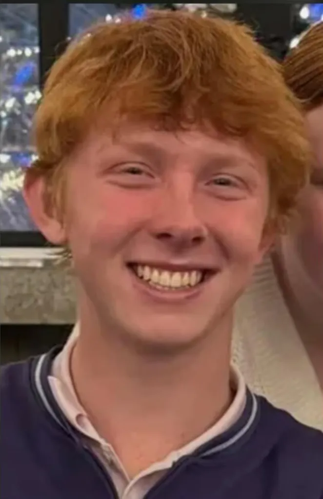 A headshot of Jack Fleischaker smiling, wearing a dark blue and white collared shirt.