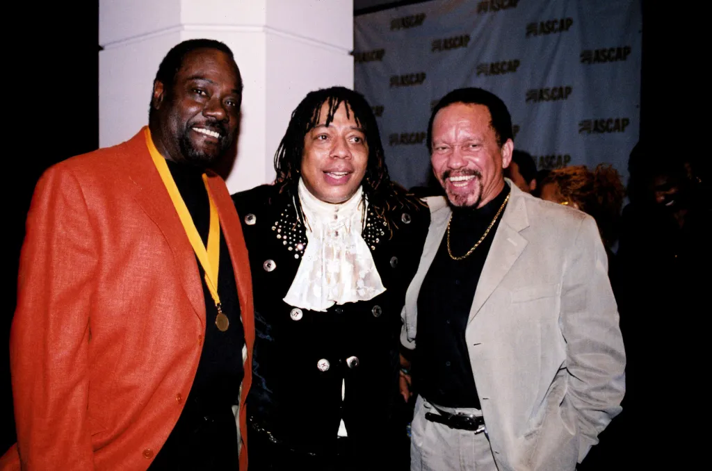 Ronald LaPread and Milan Williams of The Commodores with Rick James on the red carpet.