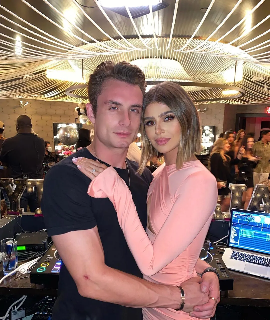 James Kennedy and Raquel Leviss pose for a photo with her arm around him, wearing an engagement ring.