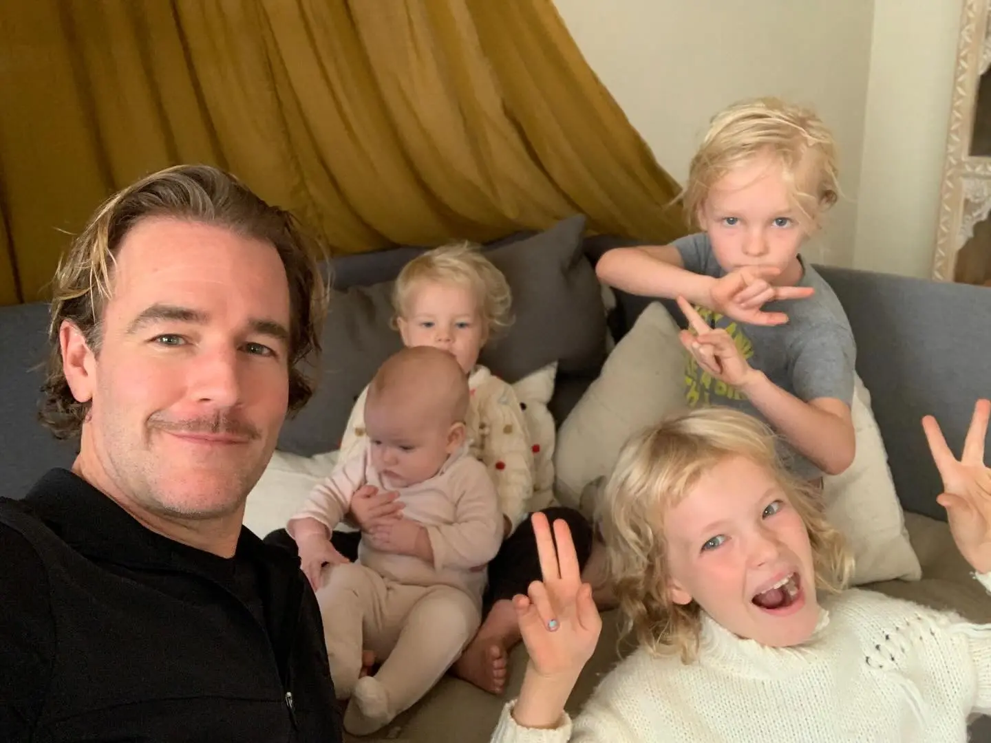 James Van Der Beek taking a selfie with his four children.